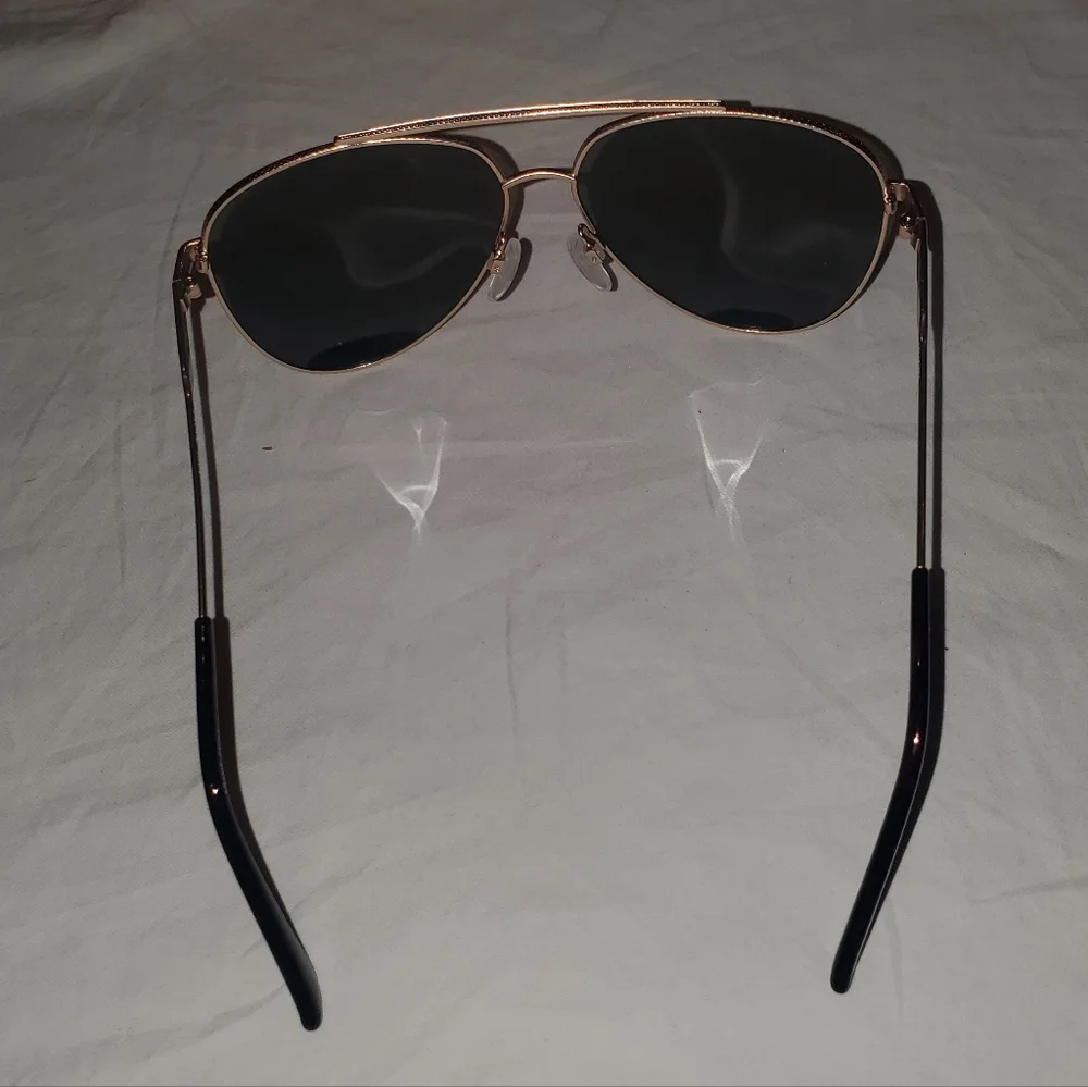 Cole Haan gold aviator sunglasses with dark lenses. Polarized.